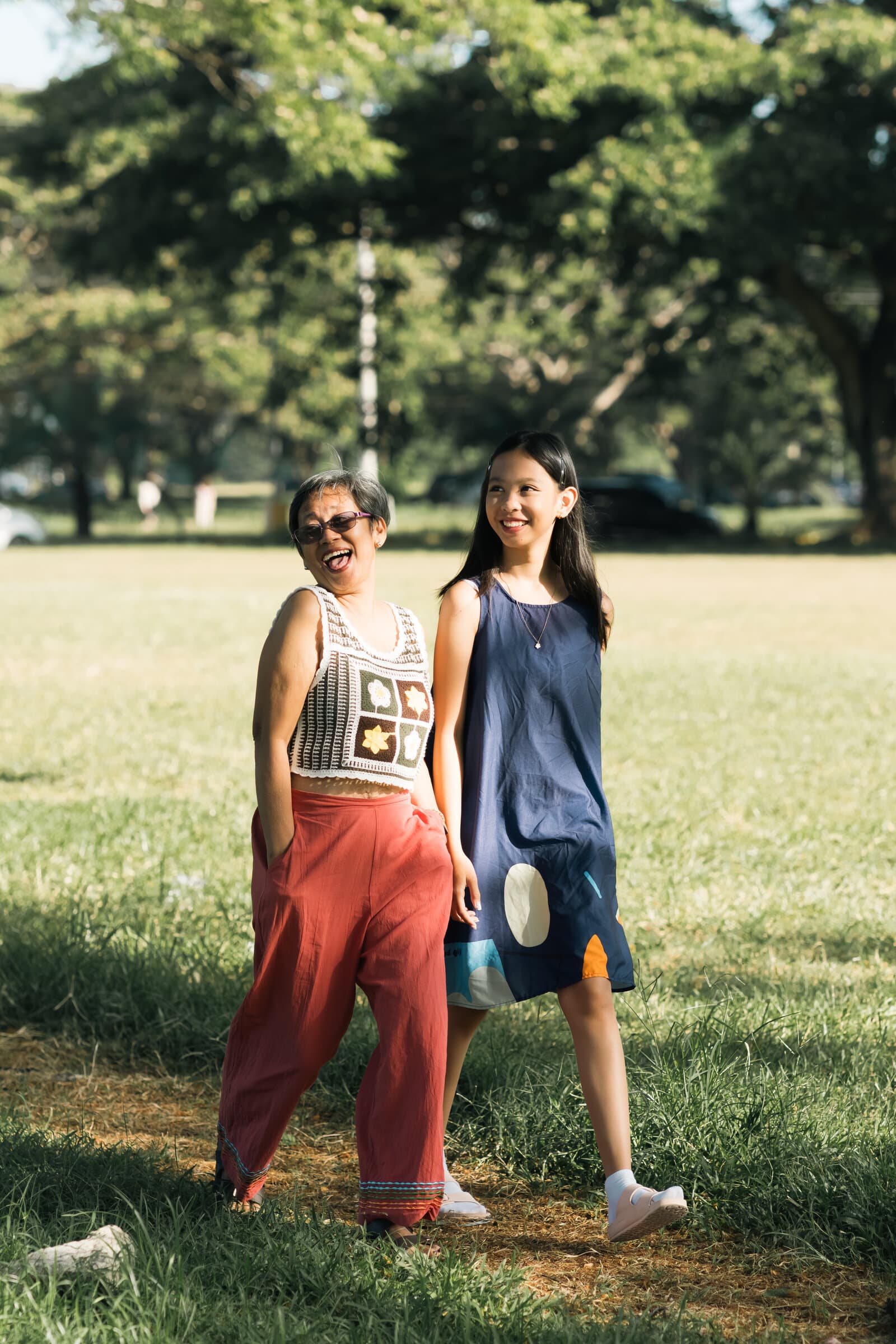 Mother and daughter walking in the park