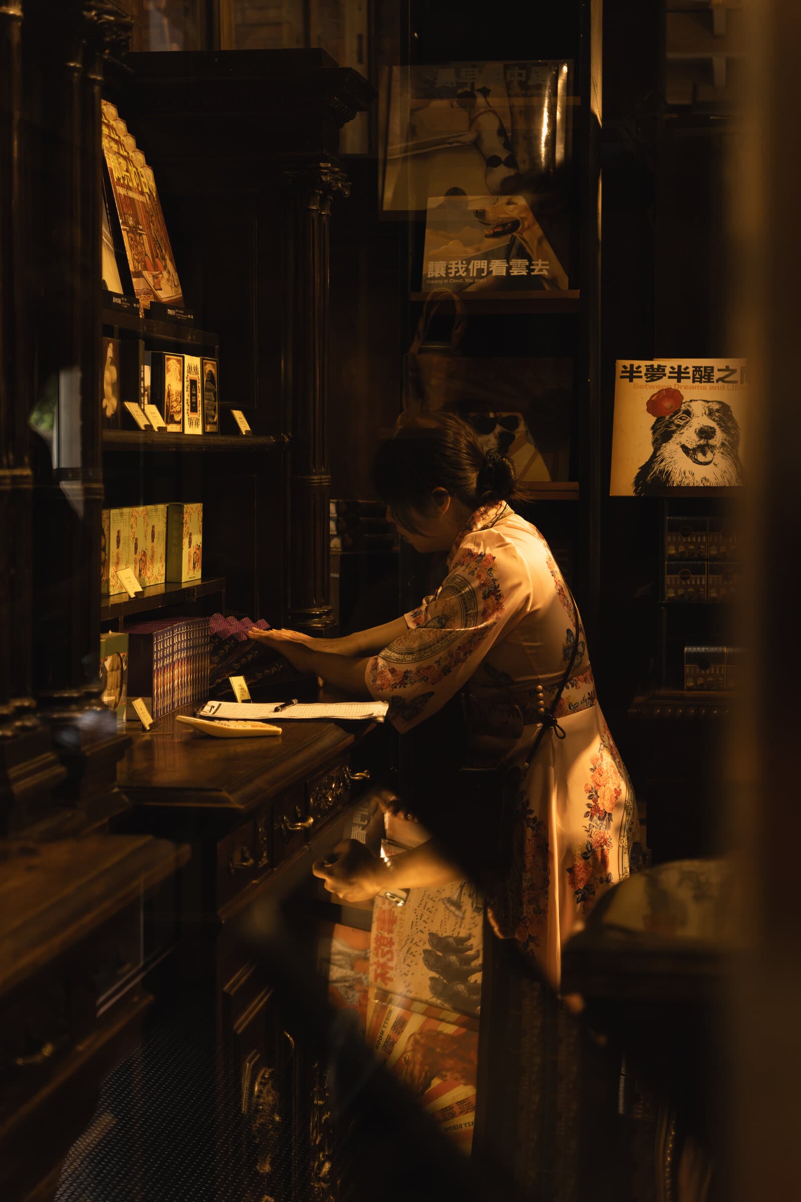 Browsing a tea shop in lamplight